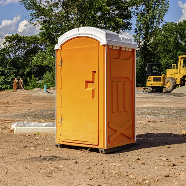 what is the cost difference between standard and deluxe portable toilet rentals in Harter